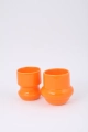 ceramiczny duet - dwa pomarańczowe kubki - jeden wklęsły, drugi wypukły